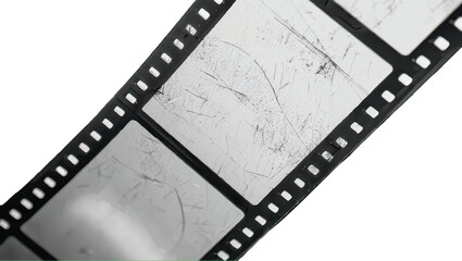 Close-up of a film strip with scratches on a white background.