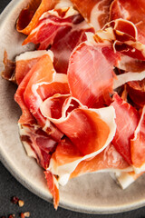 jamon serrano meat appetizer jamon iberico natural product tasty snack fresh delicious gourmet food background on the table rustic top view copy space