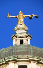Fototapeta premium Lady of Justice of the Central Criminal Court fondly known as the Old Bailey in the city of London England UK, scales of justice stock photo image