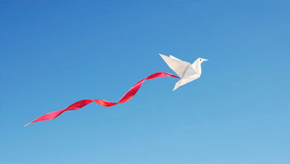 A white origami dove with a flowing red ribbon flies gracefully across a serene blue sky, symbolizing peace and freedom.