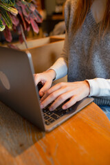 Typing, laptop and freelancer with hands of woman in home office for copywriter, research and blog article. Client feedback, remote work and closeup of person in apartment for email marketing