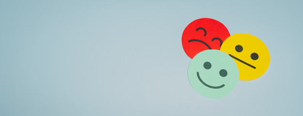Happy face Sad face Neutral face Emotion Colored circles Blue background Expression symbols Mood representation Positive emotion Negative emotion Mixed feelings Smiley face Frown face