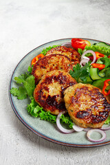 fried chicken cutlets, minced chicken, with vegetables, on gray , with vegetable salad, top view, homemade, no people,