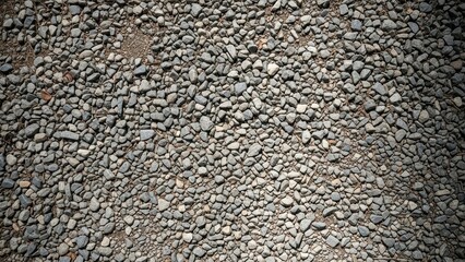 Close-up view of gravel surface with mixed pebbles and rocks