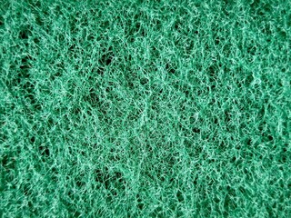 Vibrant green fibrous cleaning pad surface