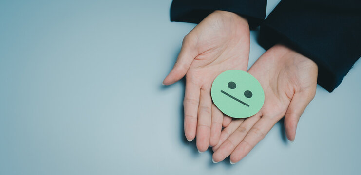 Neutral face emoji hands person emotion expression gesture isolated blue background human palm communication symbol sign feeling mood adult skin casual closeup one person holding isolated object