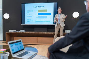 Woman presenting product growth strategy during business meeting