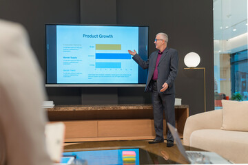 Senior man presenting market analysis product growth data