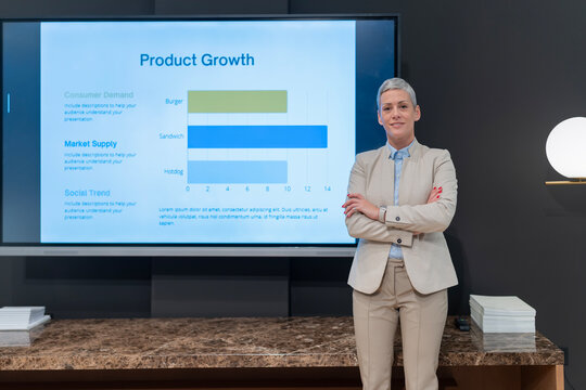 Confident businesswoman presenting product growth data in office - Powered by Adobe