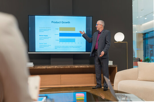 Senior man presenting market analysis product growth data