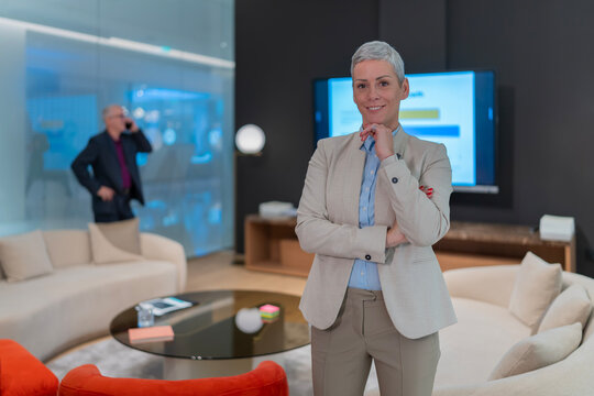 Confident businesswoman smiling in modern office setting