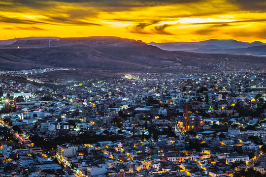 Aerial view of a city during a red sunset, view of the city of Zacatecas from La Bufa