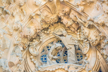 Barcelone, Spain - July 12 2025: The delicate artistic engraving sculpture work on the Nativity Façade of the Sagrada Famillia Basilique in Barcelone Spain
