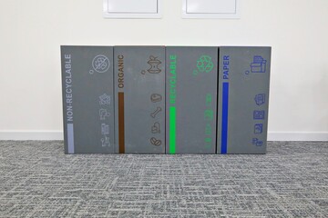 Worker installing scaffolding on building, showcasing the teamwork and safety equipment required for scaffold setup on construction site, focusing on safety harnesses and work platforms.