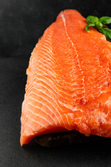 Salmon fillet raw red fish seafood dish natural tasty snack fresh delicious gourmet food background on the table rustic top view copy space pescetarian diet