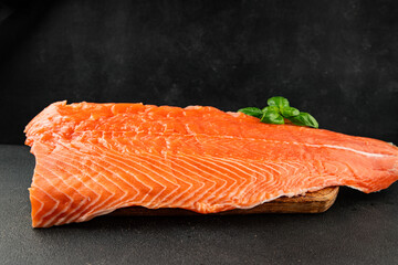 Salmon fillet raw red fish seafood dish natural tasty snack fresh delicious gourmet food background on the table rustic top view copy space pescetarian diet