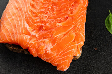 Salmon fillet raw red fish seafood dish natural tasty snack fresh delicious gourmet food background on the table rustic top view copy space pescetarian diet