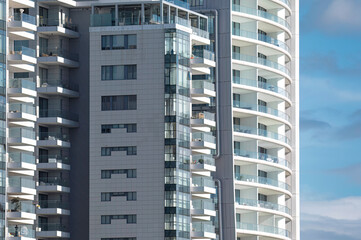 Modern apartment buildings in Limassol with glass balconies are enjoying a beautiful sunny day. Cyprus