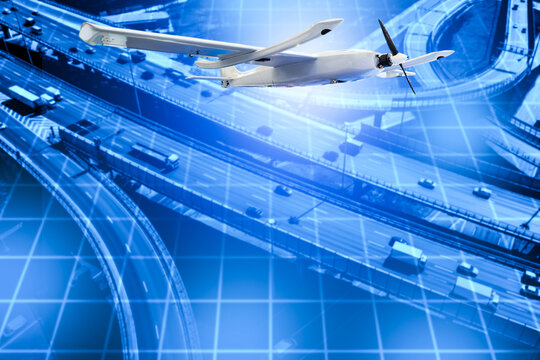 Aerial monitoring uses a fixed-wing drone flying above busy highways to capture traffic data, support transport analysis and enhance roadway management.