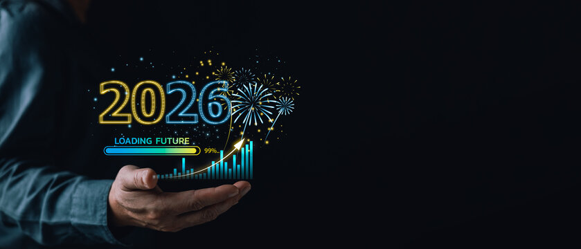 2026 New Year celebration business growth concept. Hand holding virtual chart, fireworks, loading future bar. Financial success strategy and digital planning on dark background.