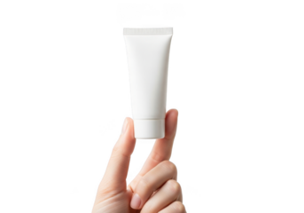 Hand holding a small white cosmetic cream or lotion tube product mockup isolated on transparent background for beauty and skincare presentation