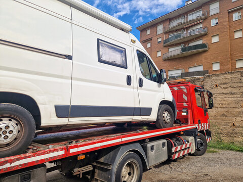 Broken down camper van on a tow truck