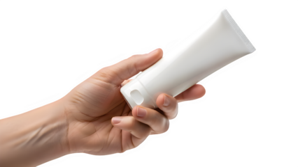 Hand holding white cosmetic tube isolated on transparent background for mockup