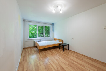 Minimalist Bedroom Interior with Wooden Furniture and a Scenic Window View