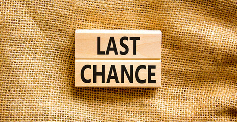 Last chance symbol. Concept word Last chance on beautiful wooden blocks. Beautiful canvas background. Business last chance concept. Copy space.