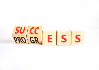 Success and progress symbol. Concept words Success and Progress on beautiful wooden cubes. Beautiful white table white background. Business success and progress concept. Copy space