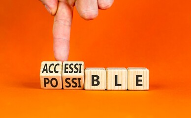 Accessible or possible symbol. Concept words Accessible or Possible on beautiful wooden blocks. Beautiful orange background. Doctor's hand. Business accessible or possible concept. Copy space.