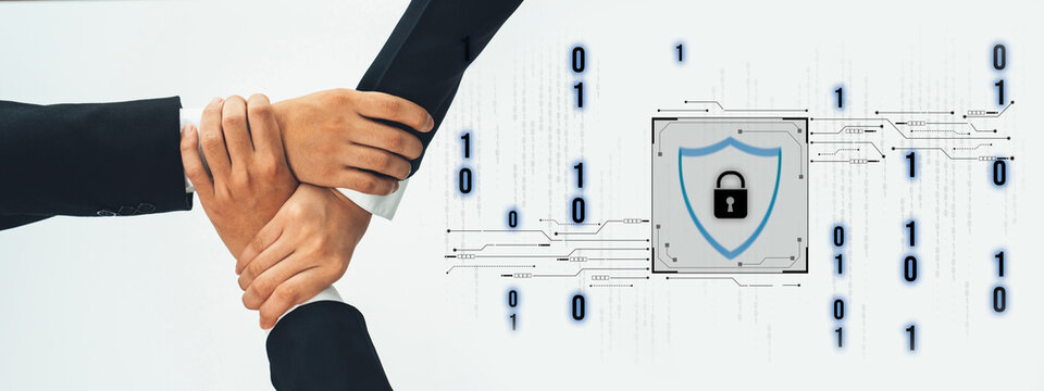 A group of diverse business professionals collaborating on cybersecurity concepts, illustrating teamwork and the importance of digital protection in today technology-driven world. Trope - Powered by Adobe