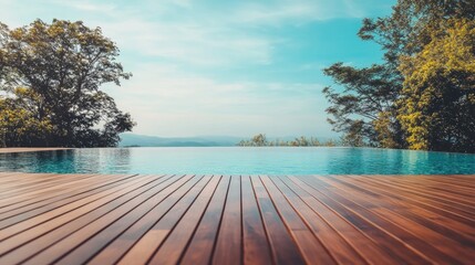 Picturesque view of a pool deck overlooking the horizon during sunset.