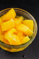 Pineapple canned chunks sweet fruit dessert tasty snack fresh delicious gourmet food background on the table rustic top view copy space keto and paleo diet vegetarian and vegan food