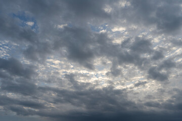 Sunset sky background with bright orange clouds.