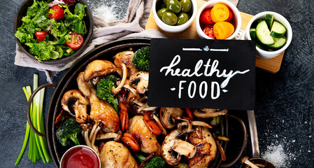 Family dinner. Roasted chicken with vegetables. Healthy eating.