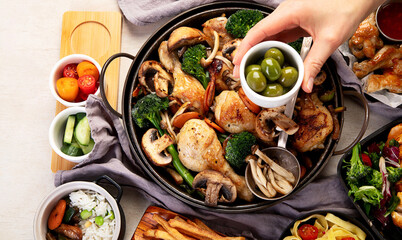 Family dinner. Roasted chicken with vegetables. Healthy eating.