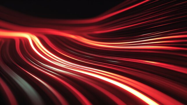 Abstract red light trails flowing across a dark background creating a dynamic and vibrant effect