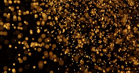 Abstract particles of gold dust float in the air