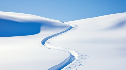 Obraz premium Ski Track on Snowy Hill Under Blue Sky, Winter ,Snowscape
