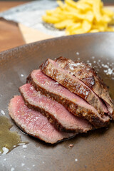 Sliced grilled steak served with coarse salt