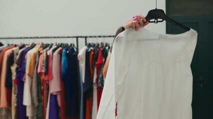 A Passionate Fashion Enthusiast Exploring the Latest Trendy Dresses in a Boutique Shop
