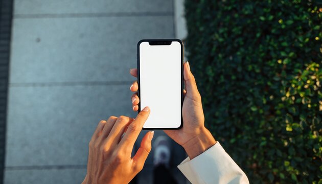 Mobile Interaction: A person's hands holding a modern smartphone with a blank screen, suggesting the user is about to engage with the device. Capturing connection