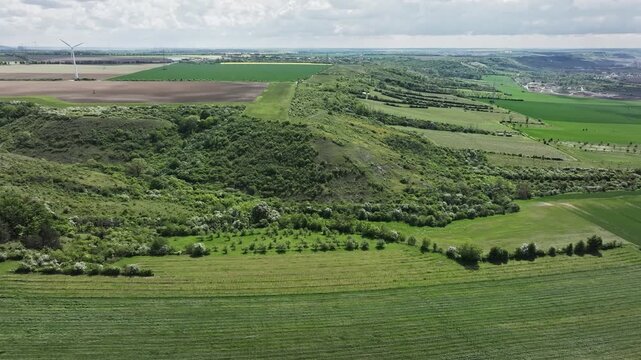 Slow aerial approach to the Querfurt Plateau in Saxony-Anhalt, showing fertile loess&ndash;chernozem soils on shell limestone within a wide agricultural landscape.