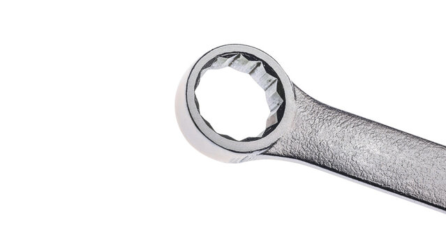 Close-up view of a chrome-plated wrench with a 12-point socket, highlighting its precise engineering and durable construction for mechanical tasks