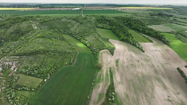 Wide aerial view of the Querfurt Plateau in Saxony-Anhalt, with finger-like shell-limestone formations rising from fertile loess&ndash;chernozem landscapes.