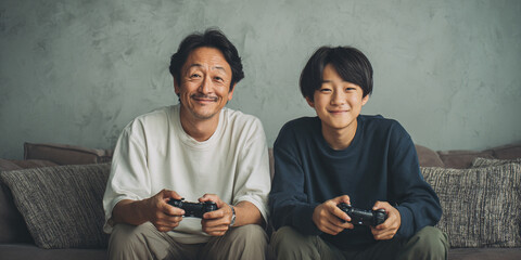 Happy father and son playing video games together on sofa at home