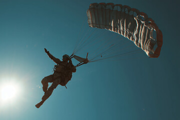 Parachutist jumping in the sky 