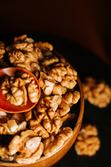 Peeled walnuts in a wooden bowl ready for healthy snacking or cooking