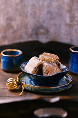 Traditional christmas cookies in a bowl on a rustic wooden background. Soft focus.	